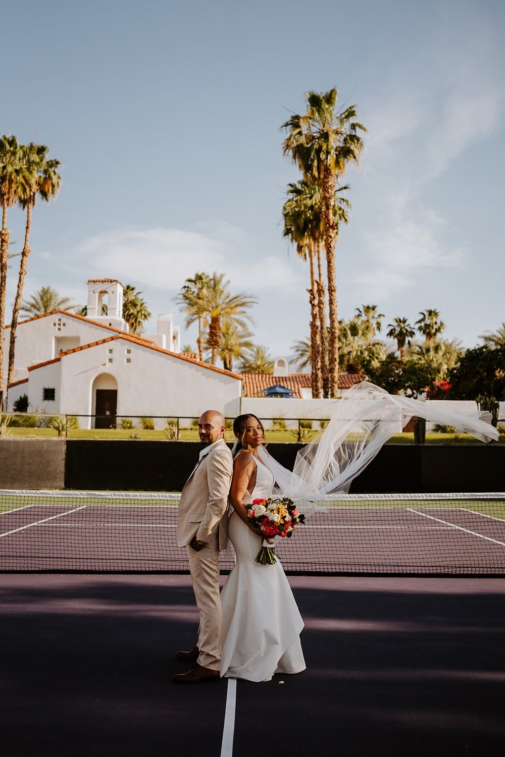 Bride and groom photos at the tennis courts at La Quinta Resort in Palm Springs | photo by Tida Svy