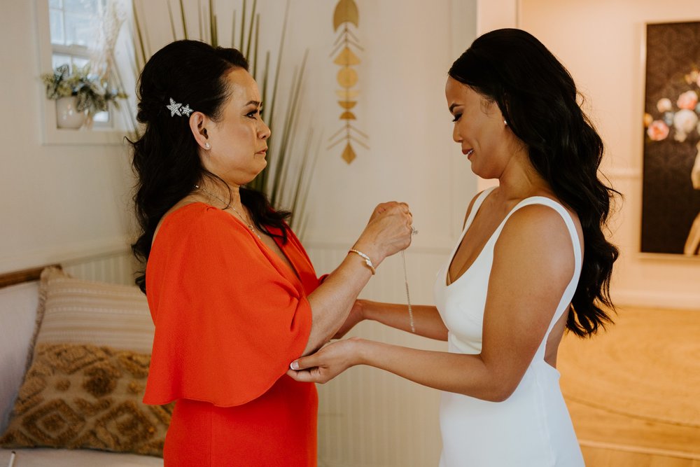 Emotional bride and mother of the bride getting ready on wedding day, photo by Tida Svy Photography