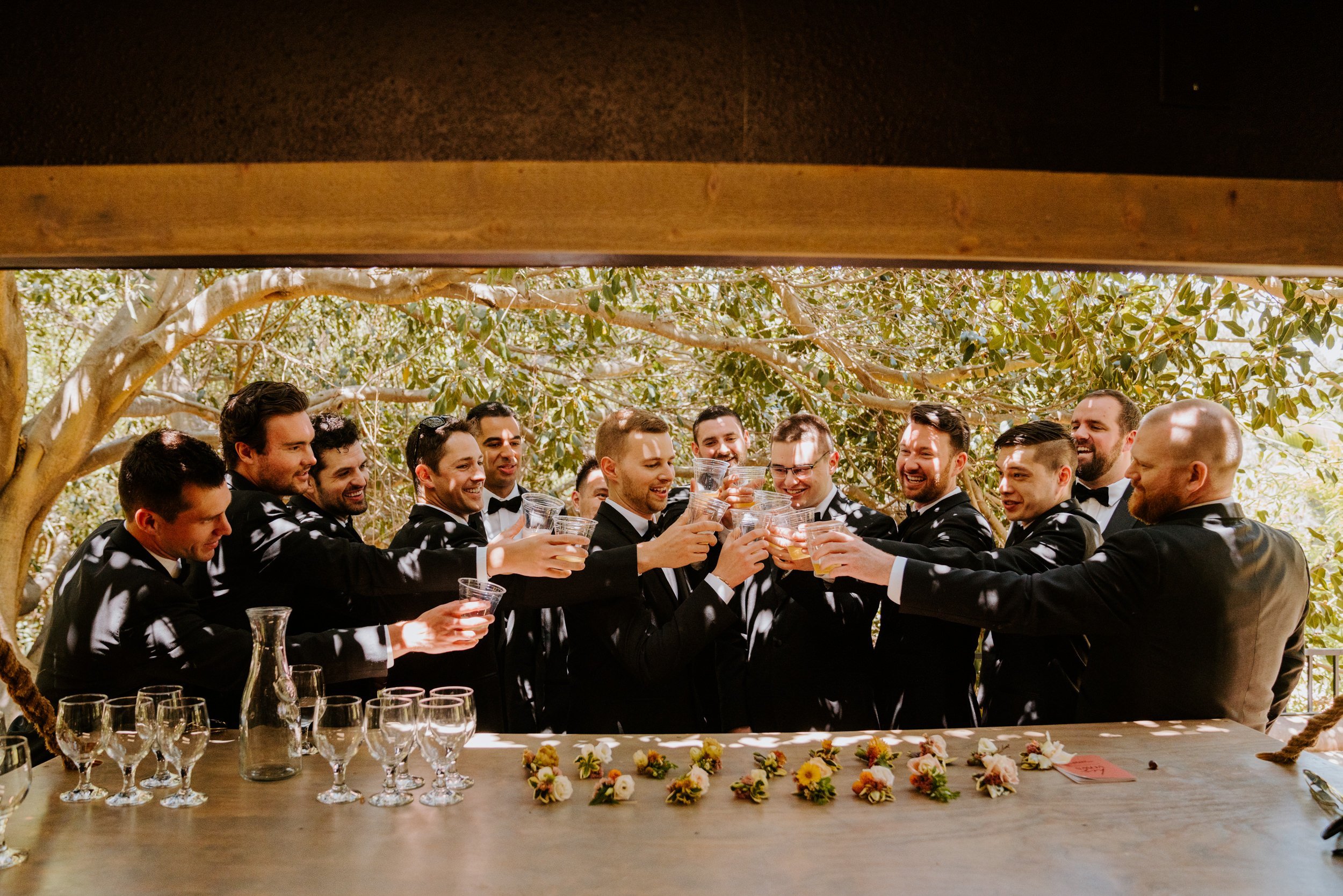 Groomsmen getting ready photo at Botanica Oceanside, photo by Tida Svy Photography