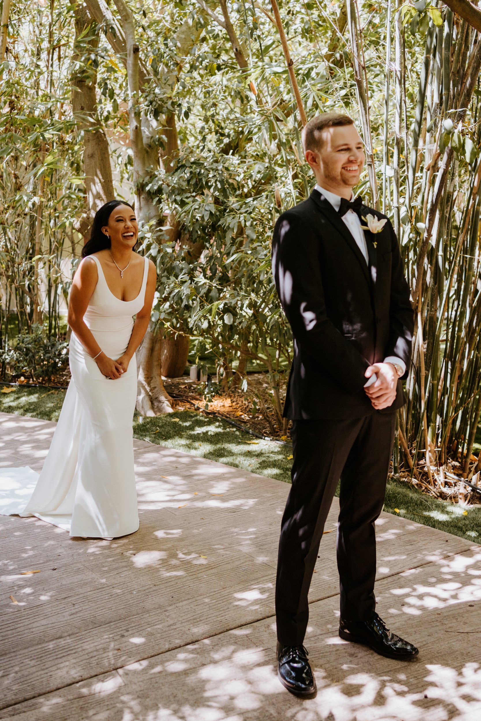 Bride and groom first look at Botanica Oceanside, photo by Tida Svy Photography