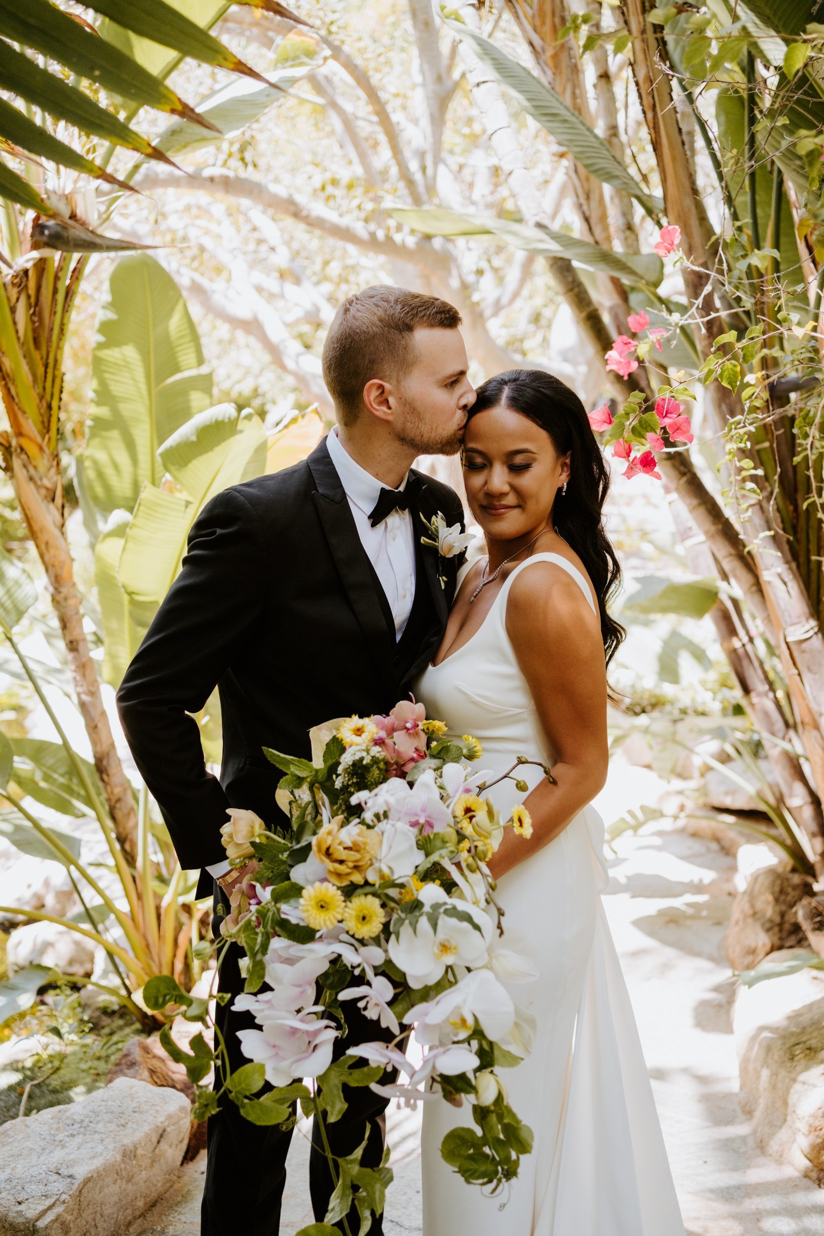 Tropical bride and groom portrait at Botanica Oceanside, photo by Tida Svy Photography, San Diego wedding photographer