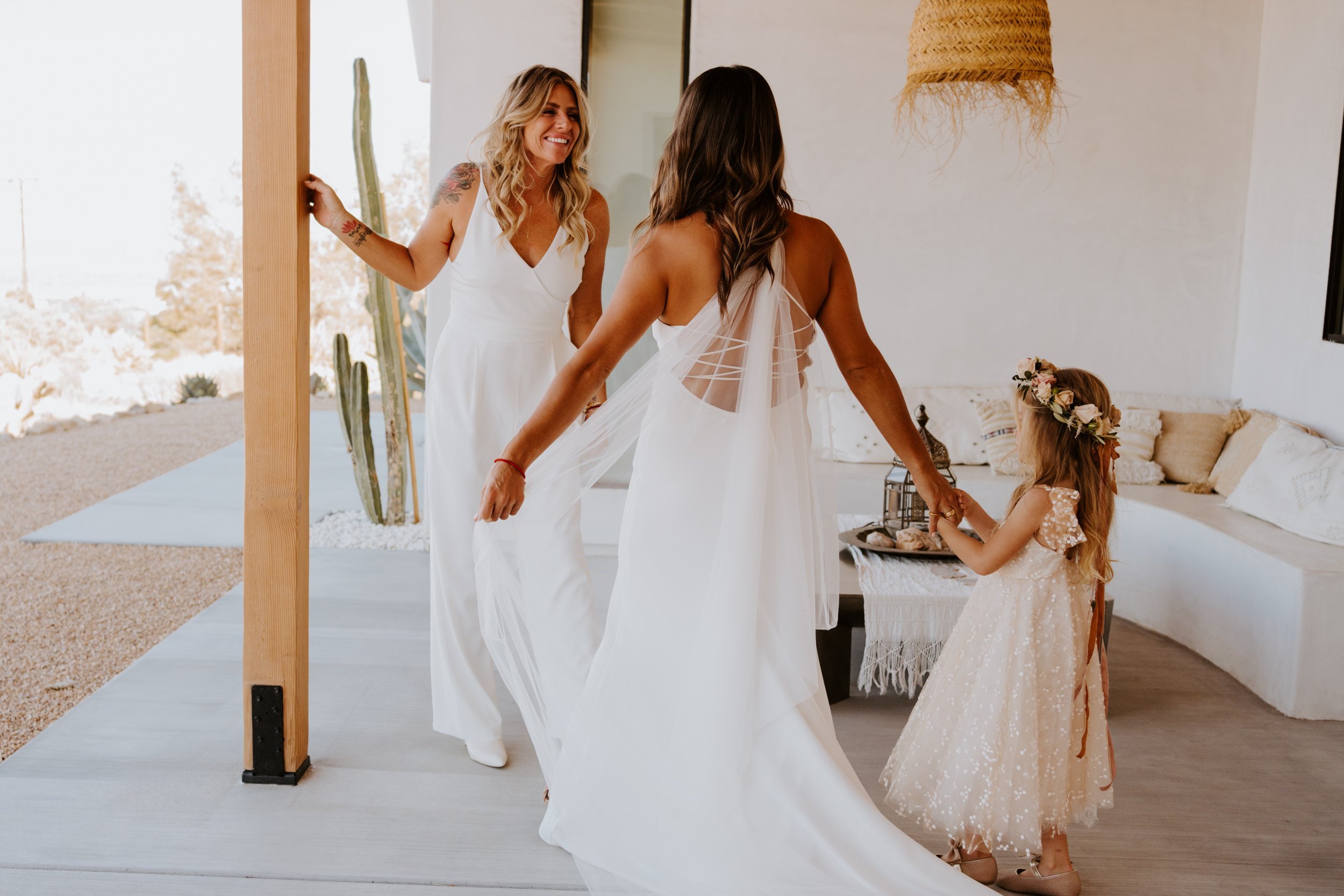 Lesbian first look, LGBTQ Joshua Tree airbnb elopement, Photo by Tida Svy