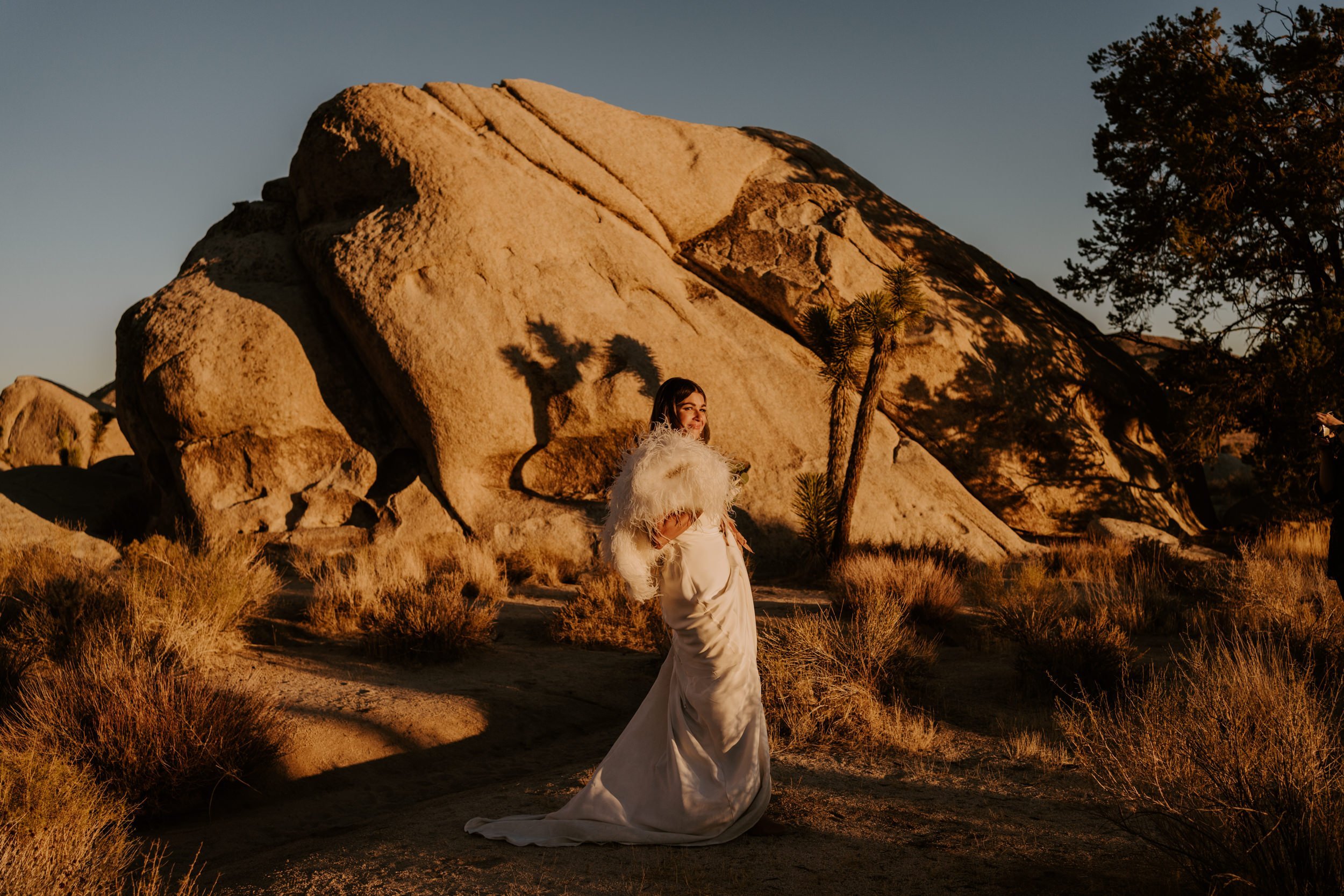 Stylish desert Joshua Tree bride with faux fur shawl, LGBTQ friendly Joshua Tree elopement photographer, Tida Svy