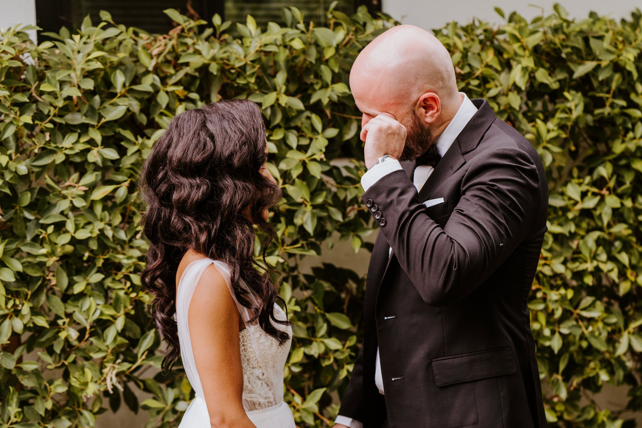 Emotional Bride and groom first look in suite at Holiday House Palm Springs, Photo by Tida Svy, Palm Springs Elopement Photographer
