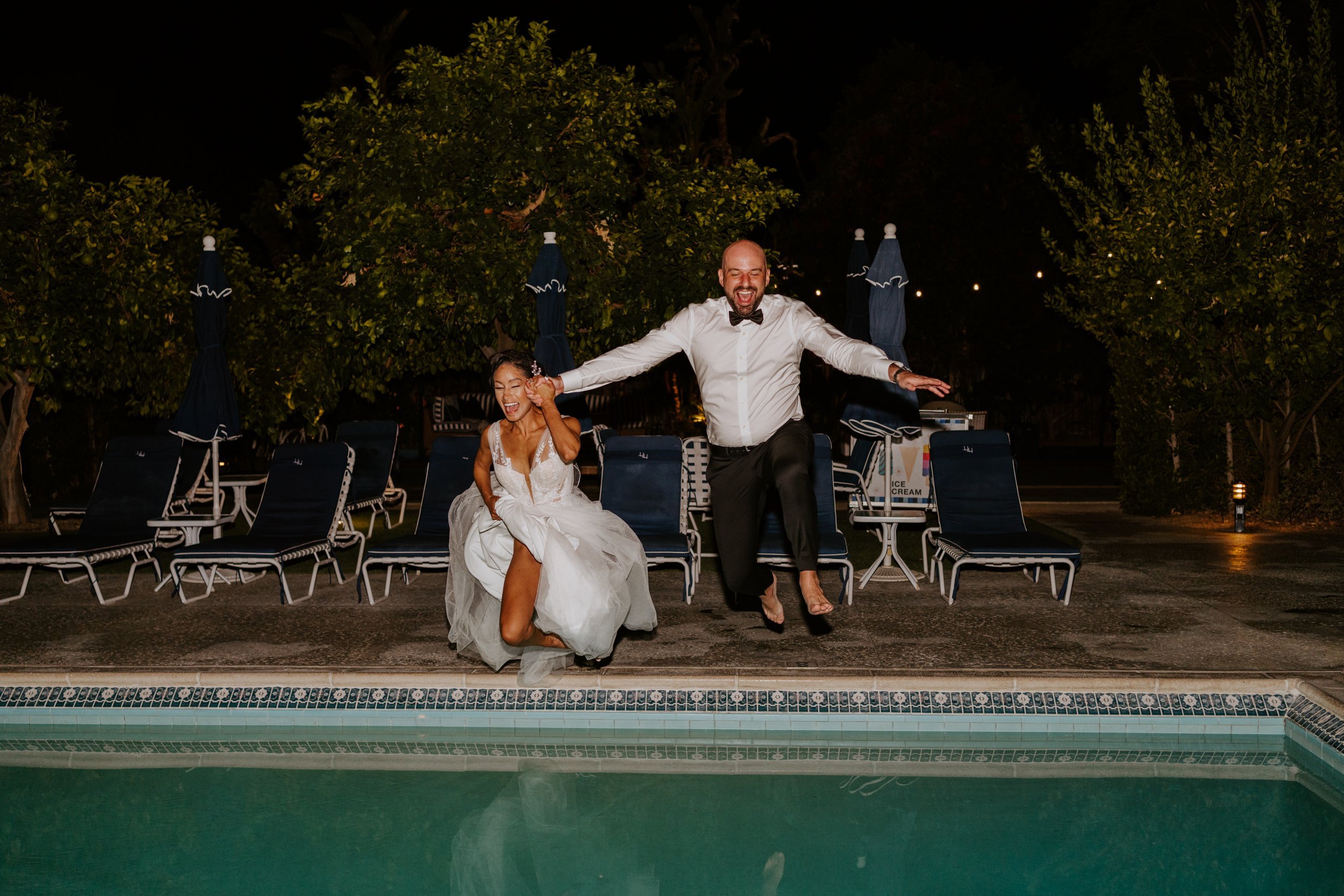 Bride and groom jumping in the pool, Holiday House Palm Springs Wedding, Palm Springs Elopement, Photography by Tida Svy
