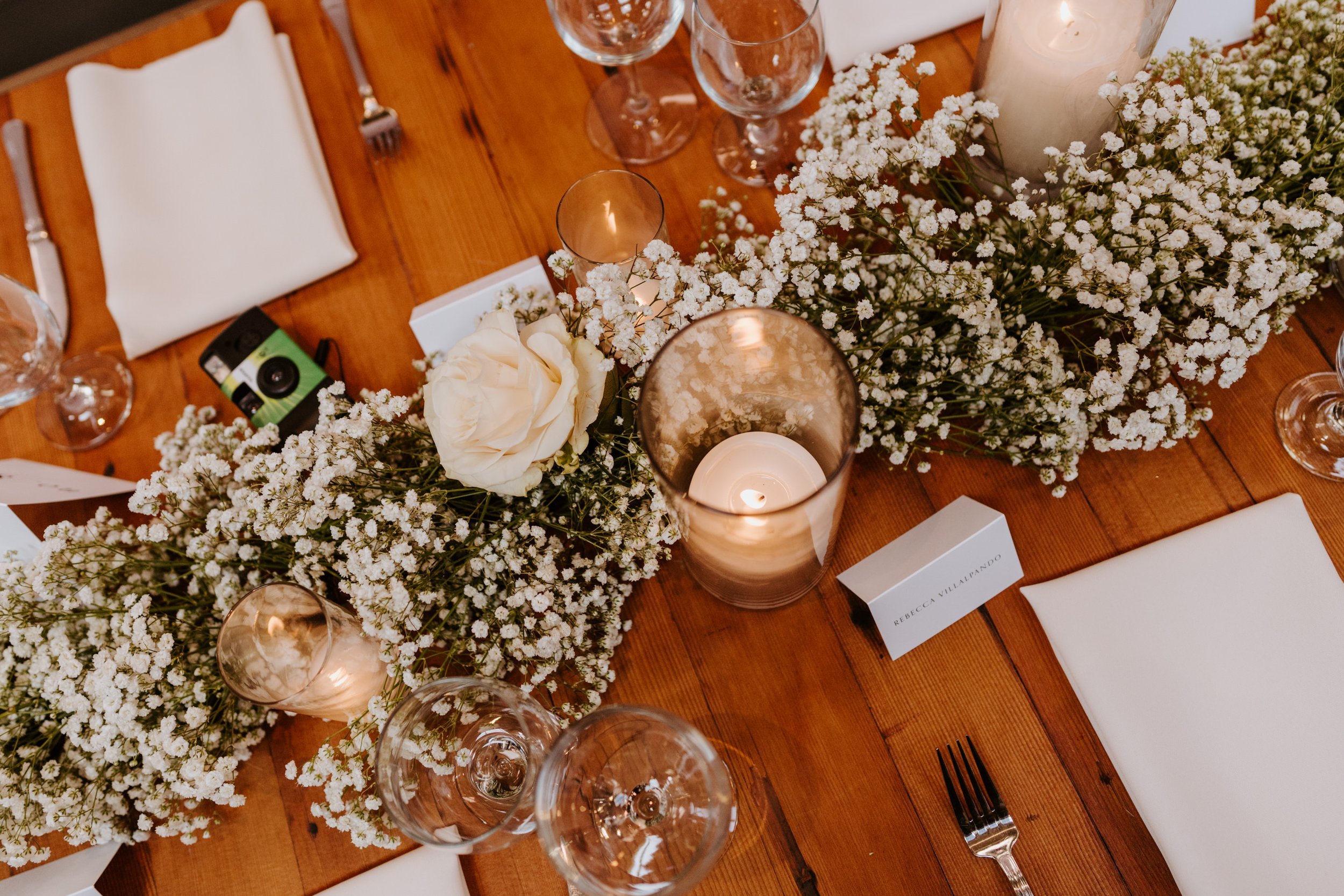 Whimsical white rose and baby’s breath reception centerpiece tablescape, grass room dtla, photo by Tida Svy, Los Angeles Wedding Photographer