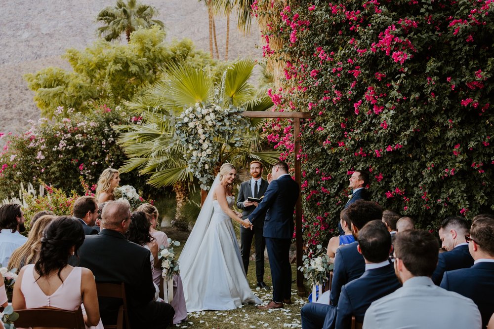 Golden hour palm springs desert Wedding ceremony setup bride and groom reading vows at The O’Donnell House wedding in Palm Springs, vibrant southern california wedding photography by Tida Svy