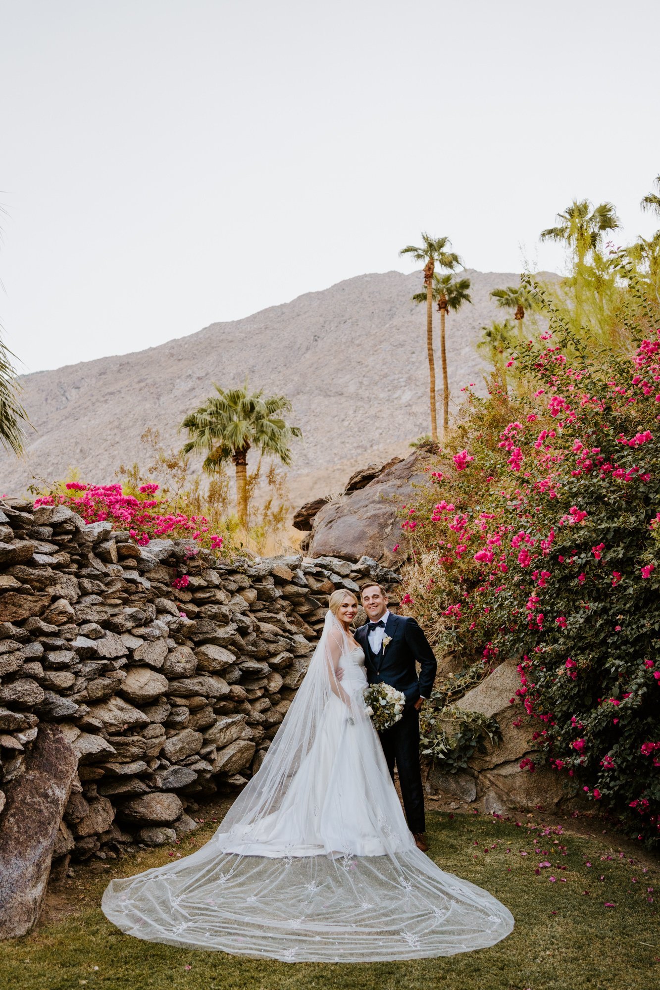 Elegant and classic bride with cathedral veil, bride and groom portrait at The O’Donnell House wedding in Palm Springs, vibrant southern california wedding photography by Tida Svy