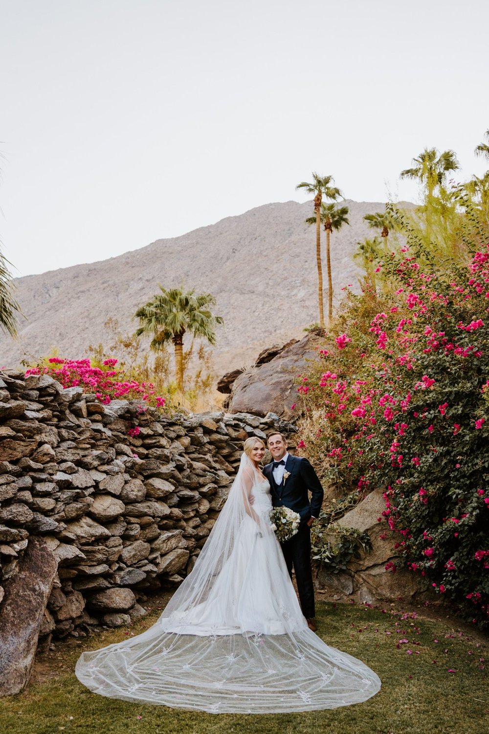 Elegant and classic bride with cathedral veil, bride and groom portrait at The O’Donnell House wedding in Palm Springs, vibrant southern california wedding photography by Tida Svy