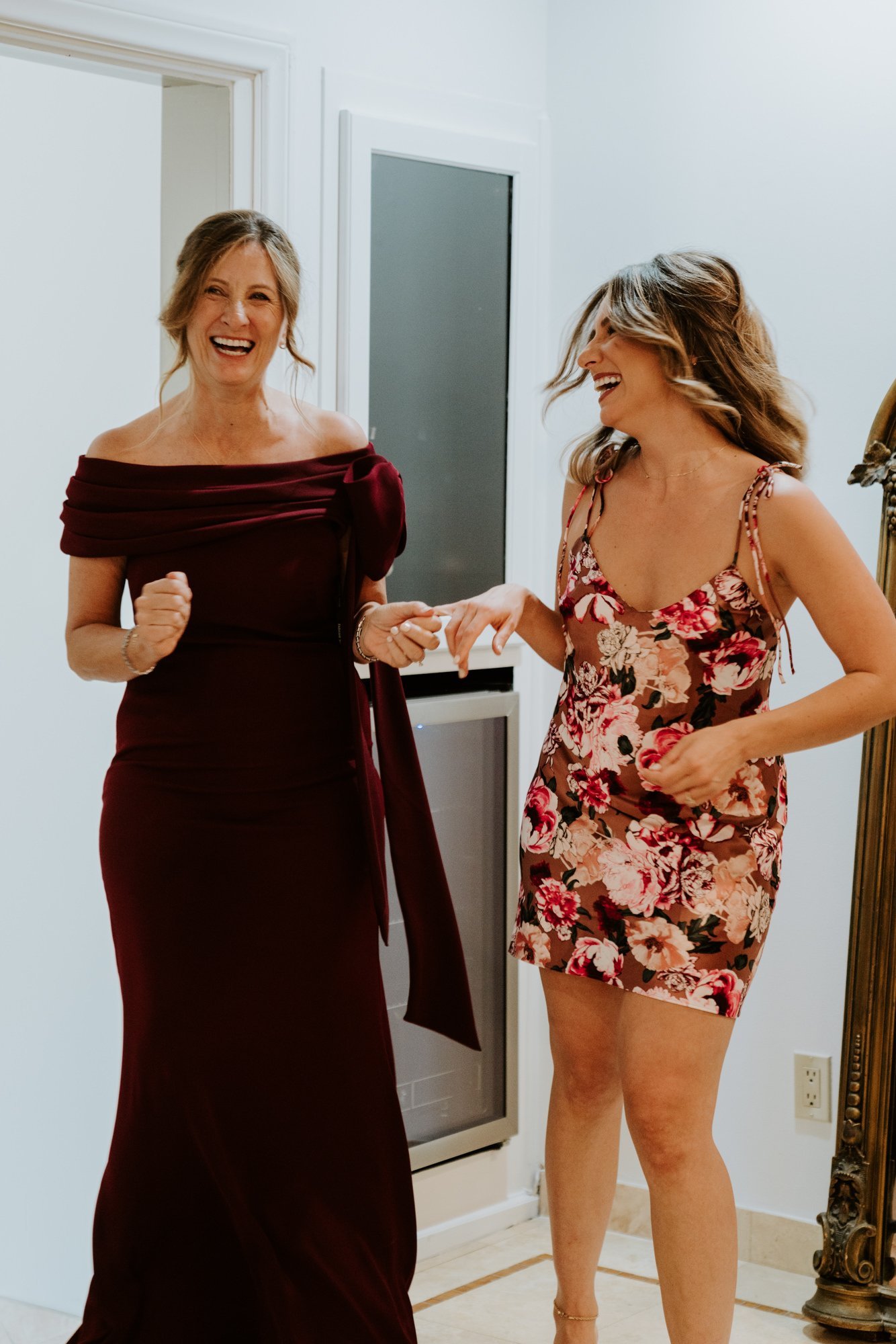 Candid photo of Bride and mother of the bride having fun while getting ready at The Houdini Estate Wedding, Los Angeles Wedding Photography by Tida Svy