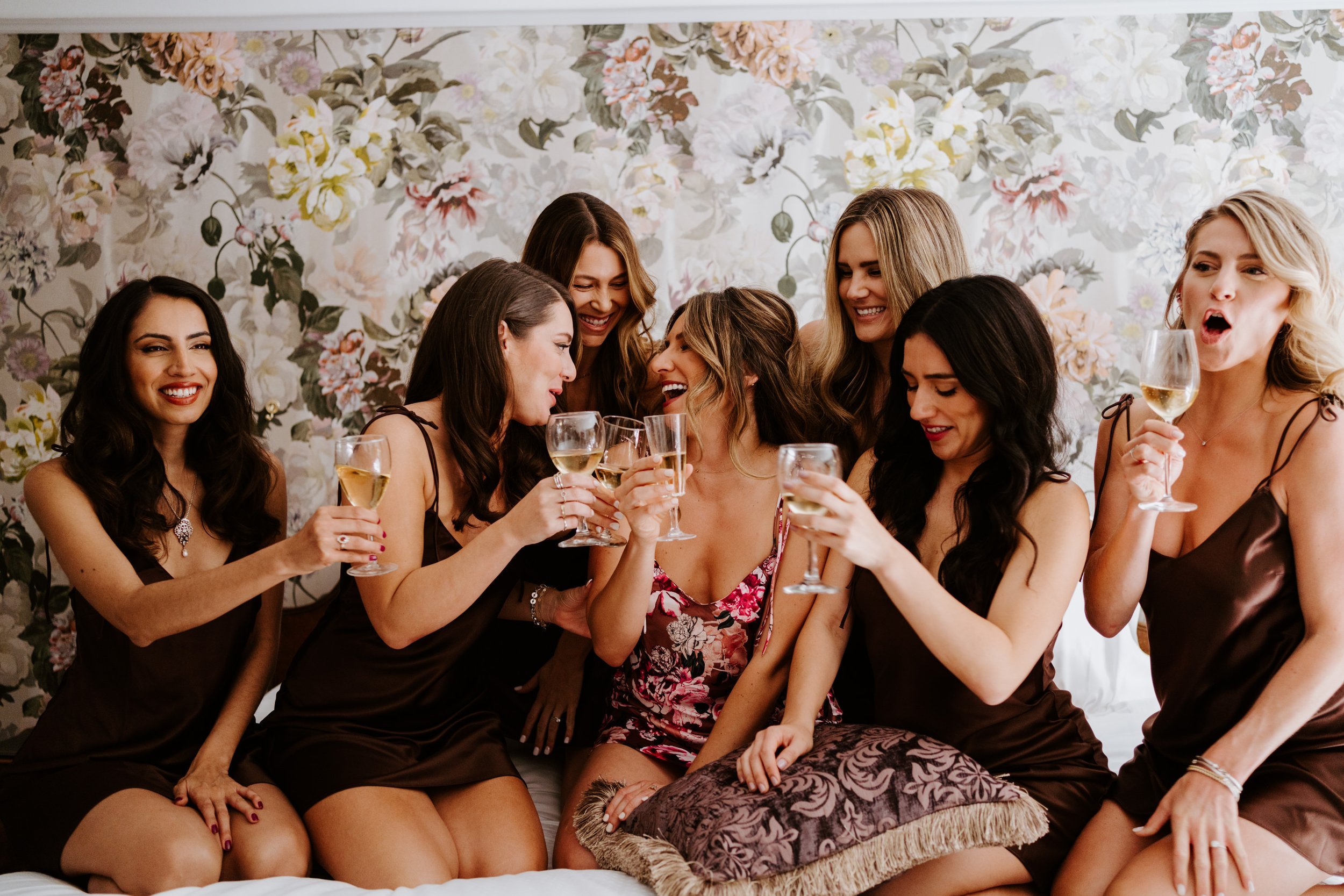 Bridesmaids in maroon pajama slips getting ready at The Houdini Estate Wedding, Los Angeles Wedding Photography by Tida Svy