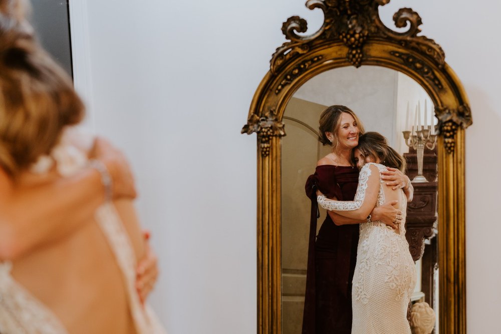 Bride and mother of the bride hugging and getting ready at The Houdini Estate Wedding, Los Angeles Wedding Photography by Tida Svy