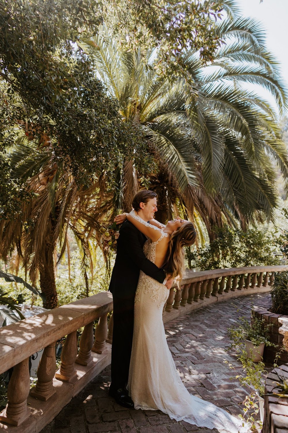 Candid laughing bride and groom portrait at The Houdini Estate wedding in los angeles, ca. Vibrant and candid los angeles wedding photography by Tida Svy