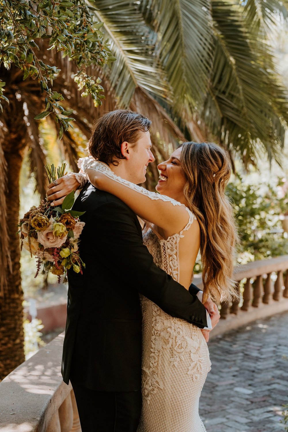 Candid laughing bride and groom portrait at The Houdini Estate wedding in los angeles, ca. Vibrant and candid los angeles wedding photography by Tida Svy