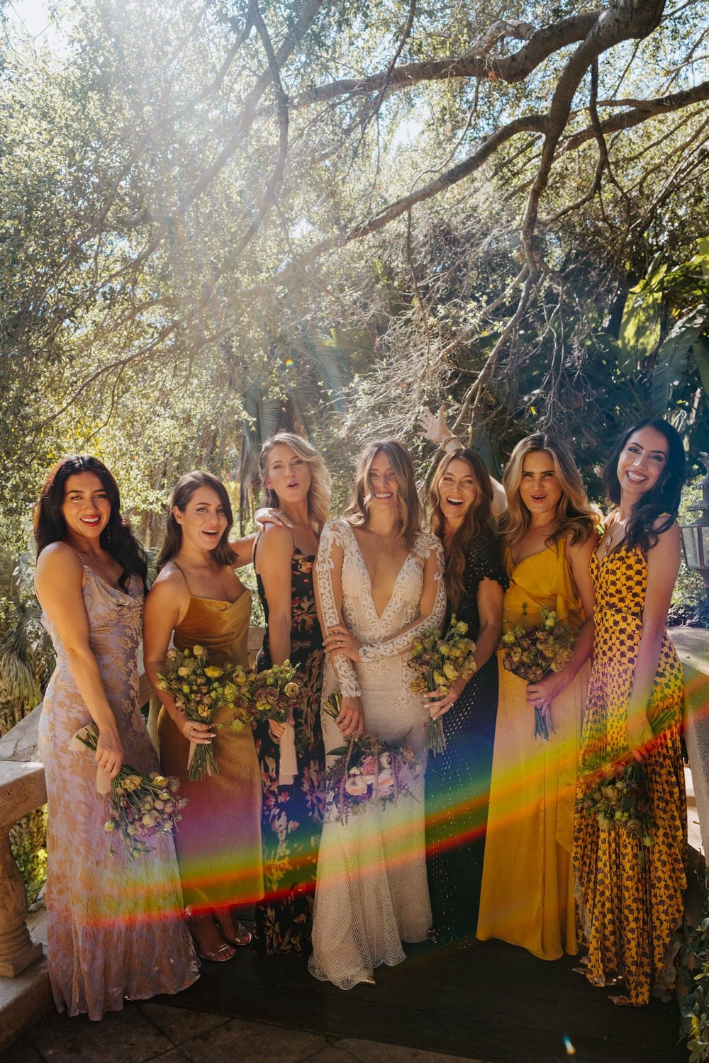 Unique and different bridesmaid dresses in a variety of gold mustard and purple at The Houdini Estate Wedding in Los Angeles, vibrant and candid wedding photographer Tida Svy