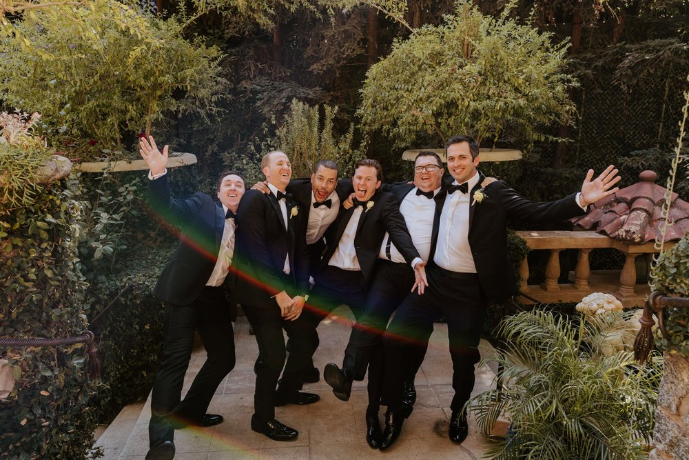 Fun groomsmen photos at The Houdini Estate Wedding in Los Angeles, vibrant and candid wedding photographer Tida Svy