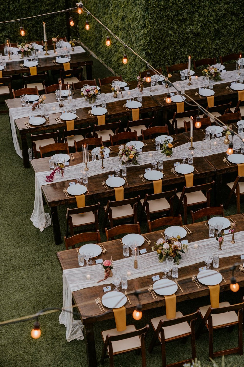 Simple romantic long wooden wedding reception tables at The Houdini Estate wedding in Los Angeles, wedding photography by Tida Svy