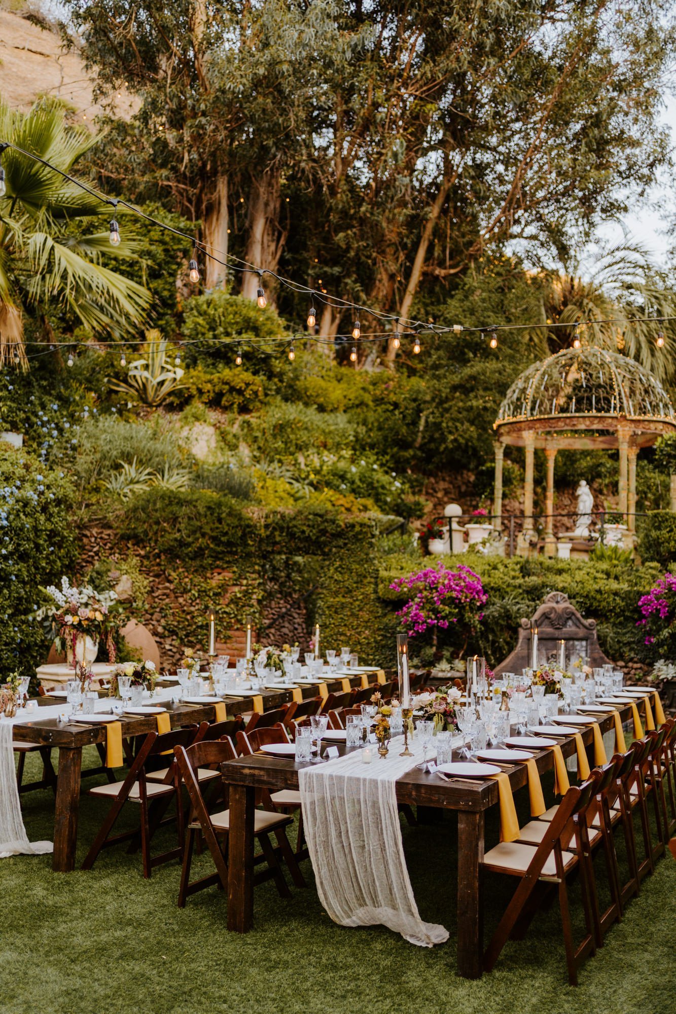 Simple romantic long wooden wedding reception tables at The Houdini Estate wedding in Los Angeles, wedding photography by Tida Svy