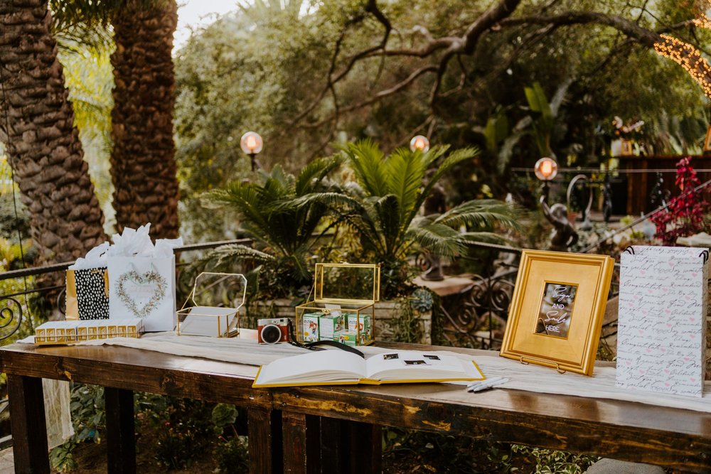 Gold guestbook table, Whimsical romantic wedding reception details at The Houdini Estate wedding in Los Angeles, wedding photography by Tida Svy