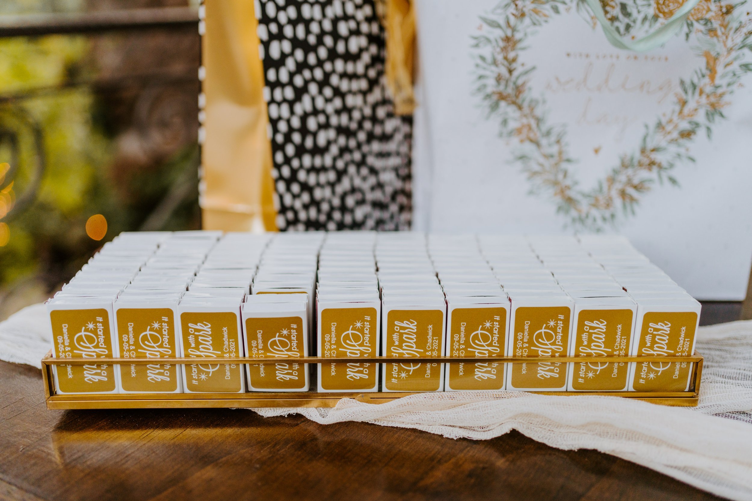 Gold matchbook wedding favors, Whimsical romantic wedding reception details at The Houdini Estate wedding in Los Angeles, wedding photography by Tida Svy