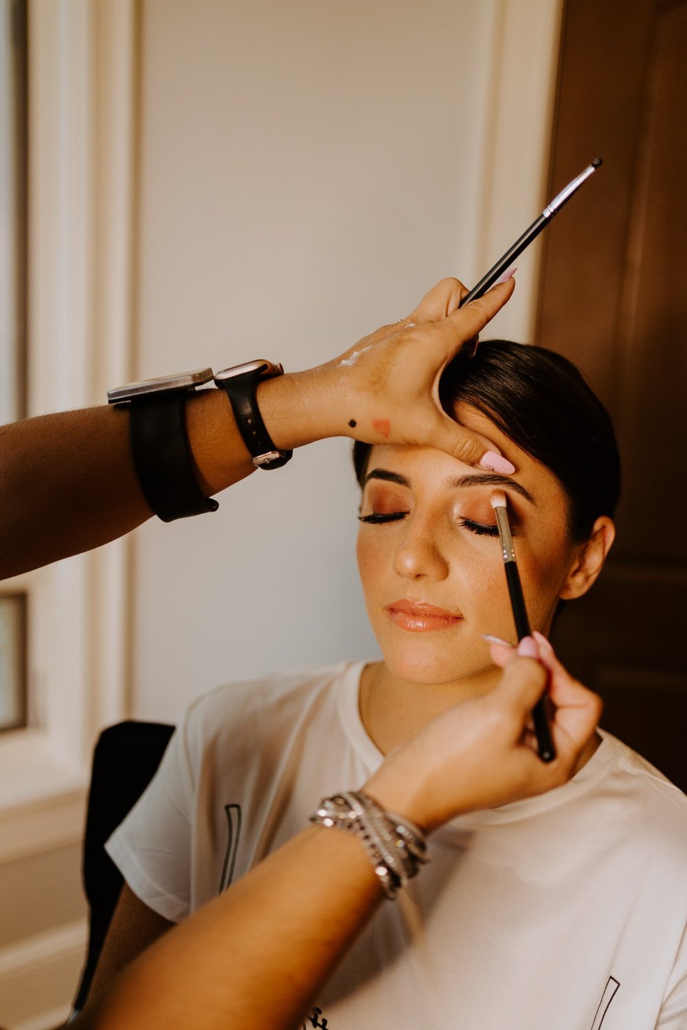 Bride getting ready, natural and warm neutral bridal makeup at Castle in the Forest Lake Arrowhead, photo by Tida Svy Photography