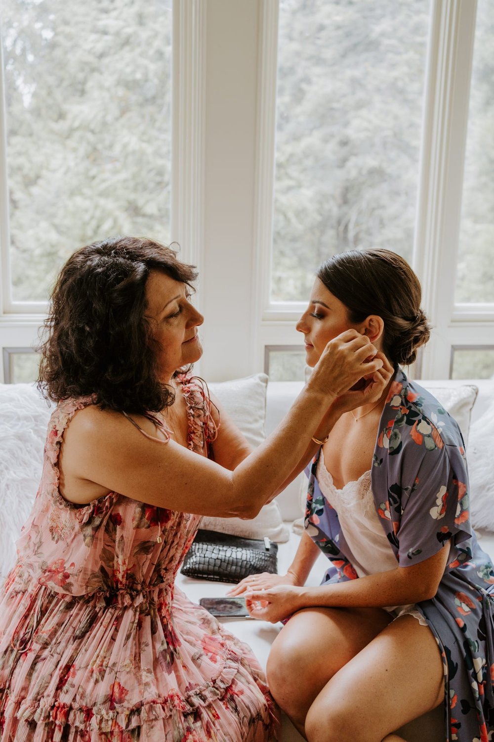 Bride and mother of the bride getting ready together in bridal suite, photo by Tida Svy Photography