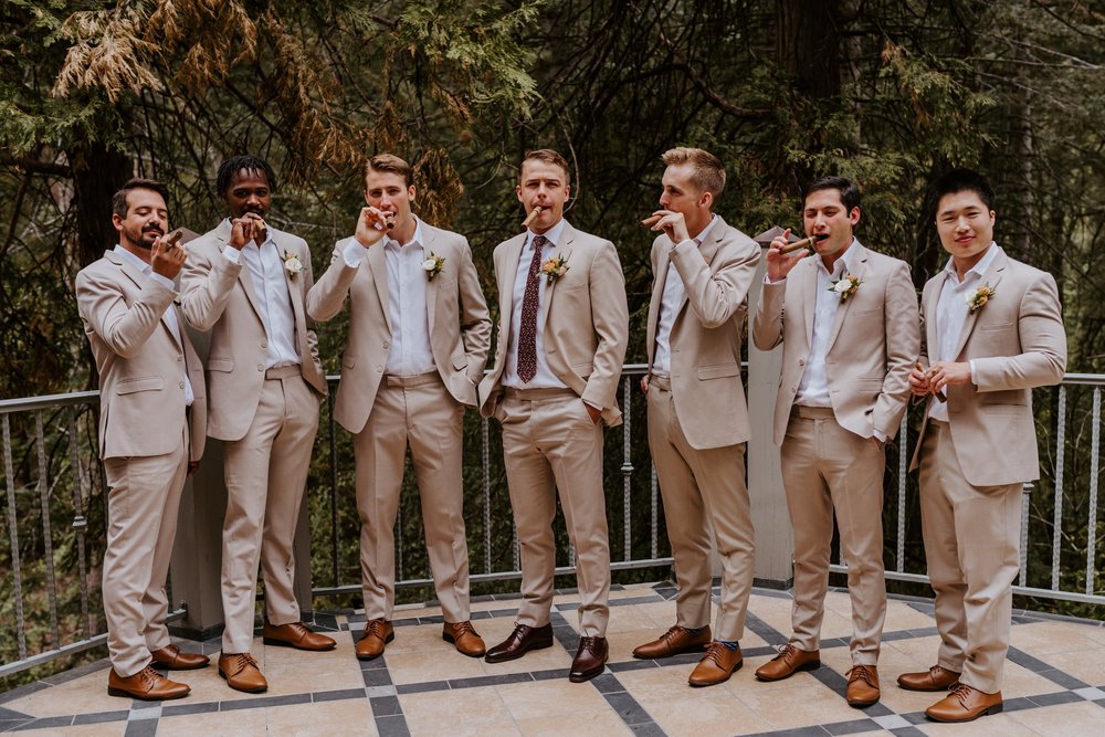 Fun groomsmen getting ready at Castle in the Forest Wedding in Lake Arrowhead, Photo by Tida Svy