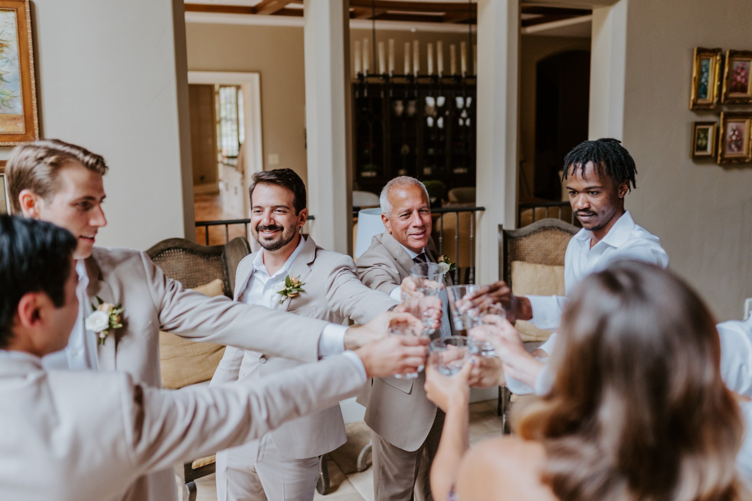 Fun groomsmen getting ready at Castle in the Forest Wedding in Lake Arrowhead, Photo by Tida Svy