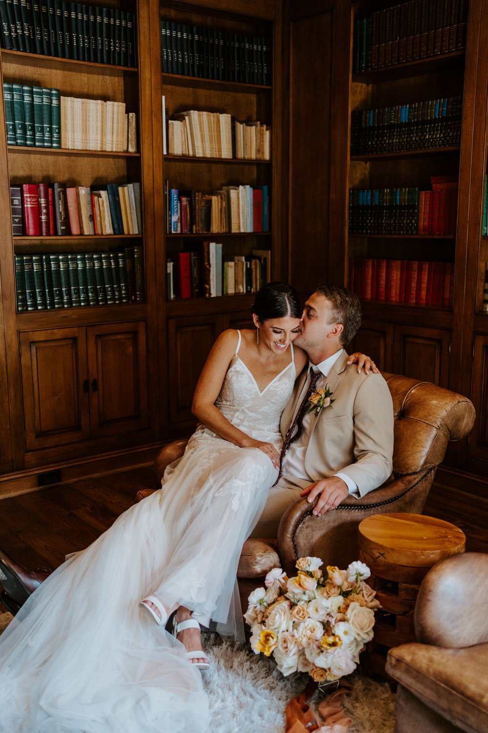 Bride and groom romantic couples photos in library at Castle in the Forest in lake arrowhead, airbnb wedding, Photo by Tida Svy