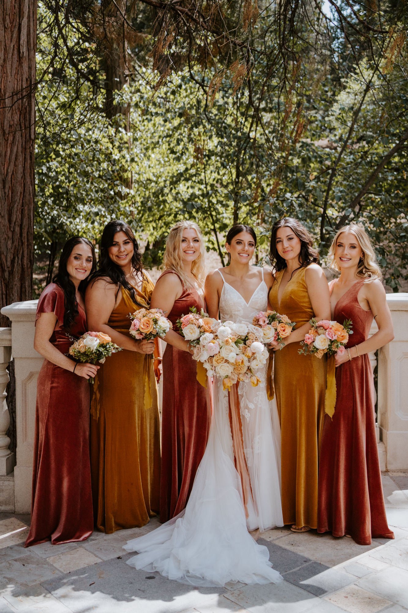 Rose gold and mustard velvet bridesmaid dresses, fall enchanted forest bridesmaid inspo, castle in the forest lake arrowhead airbnb wedding, photo by Tida Svy