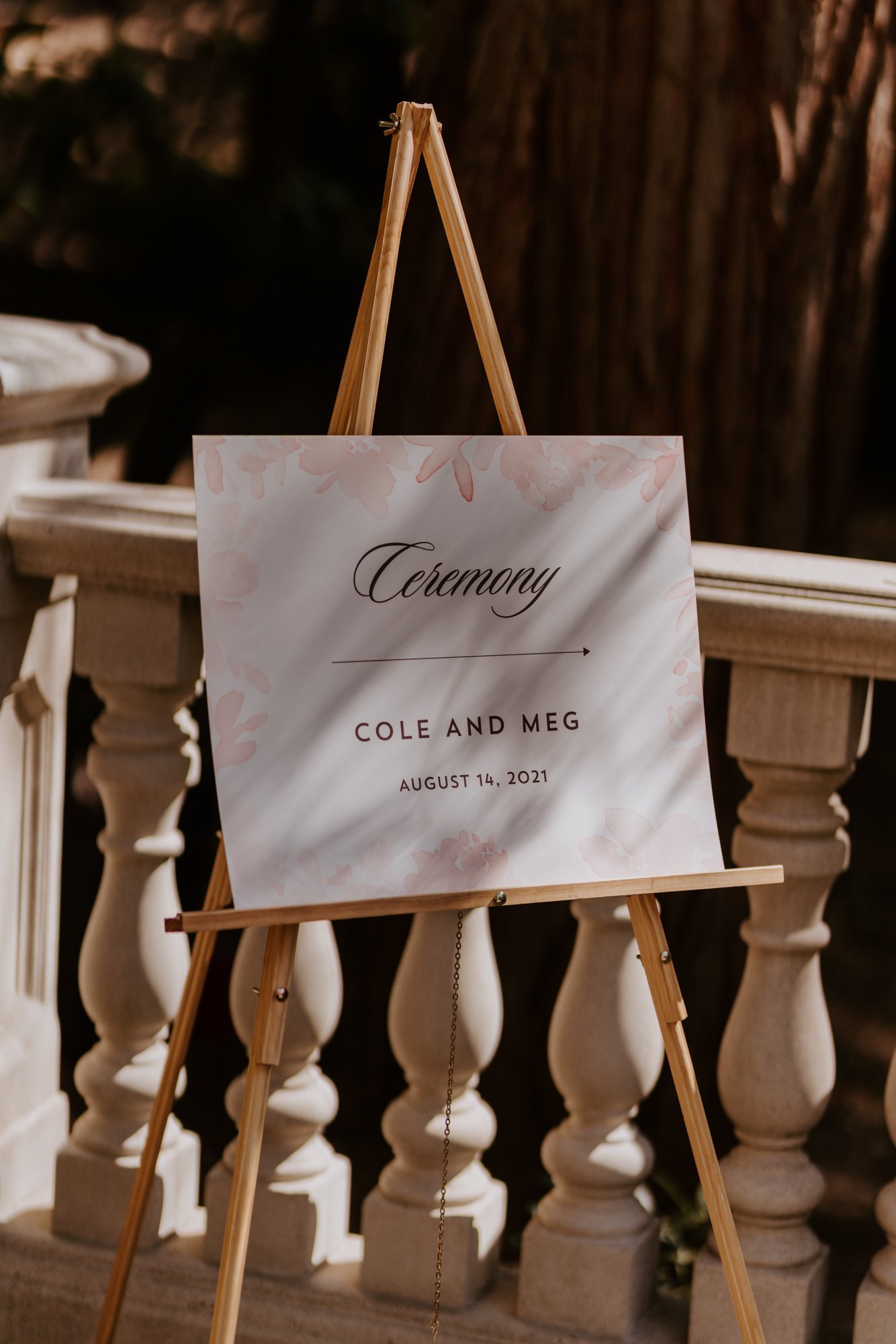 Elegant and simple Wedding ceremony sign, Castle in the forest lake arrowhead airbnb wedding, photo by Tida Svy