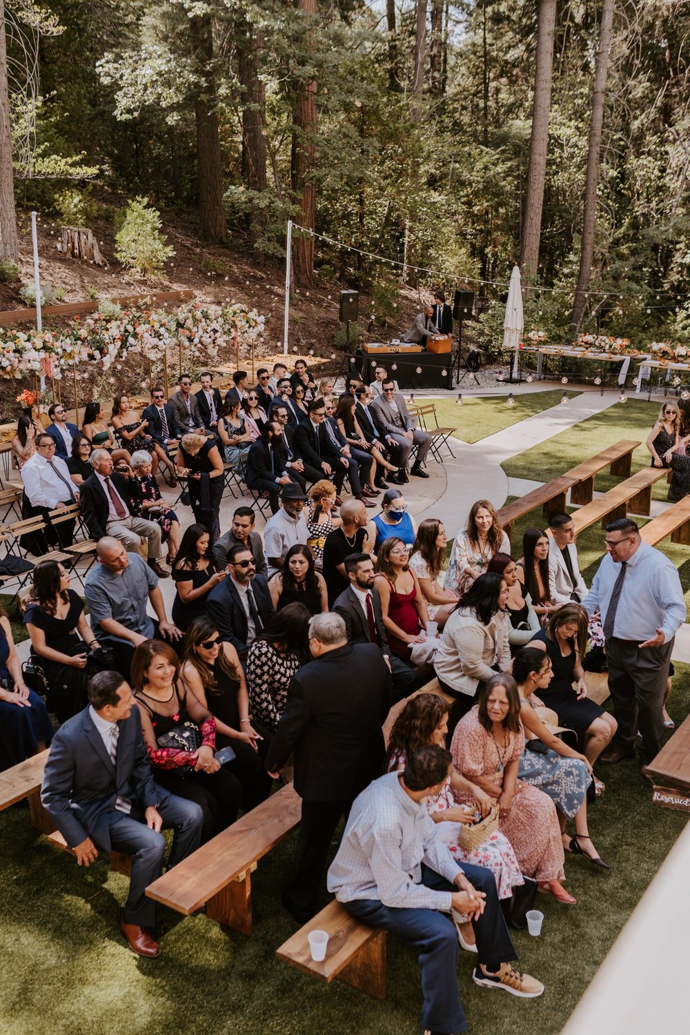 Castle in the Forest Lake Arrowhead Wedding Ceremony Set Up, Guests seated on long benches,  Photo by Tida Svy