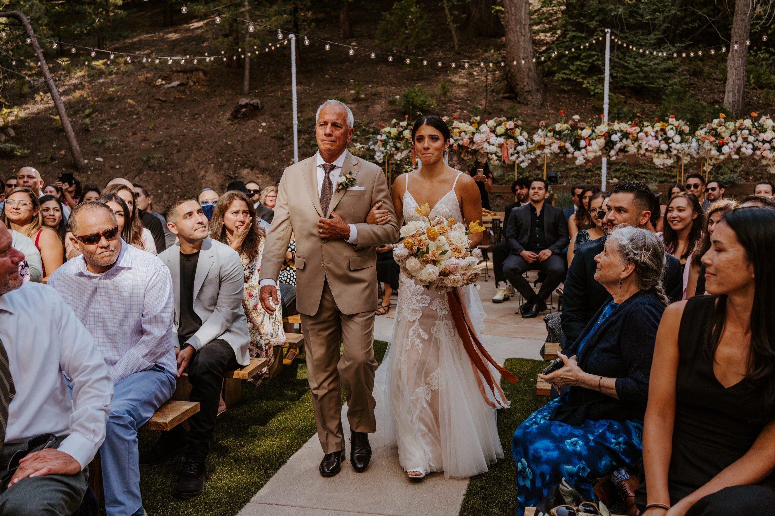 Bride and father of the bride emotional walking down the aisle, Castle in the Forest Lake Arrowhead Wedding Ceremony Set Up,  Photo by Tida Svy