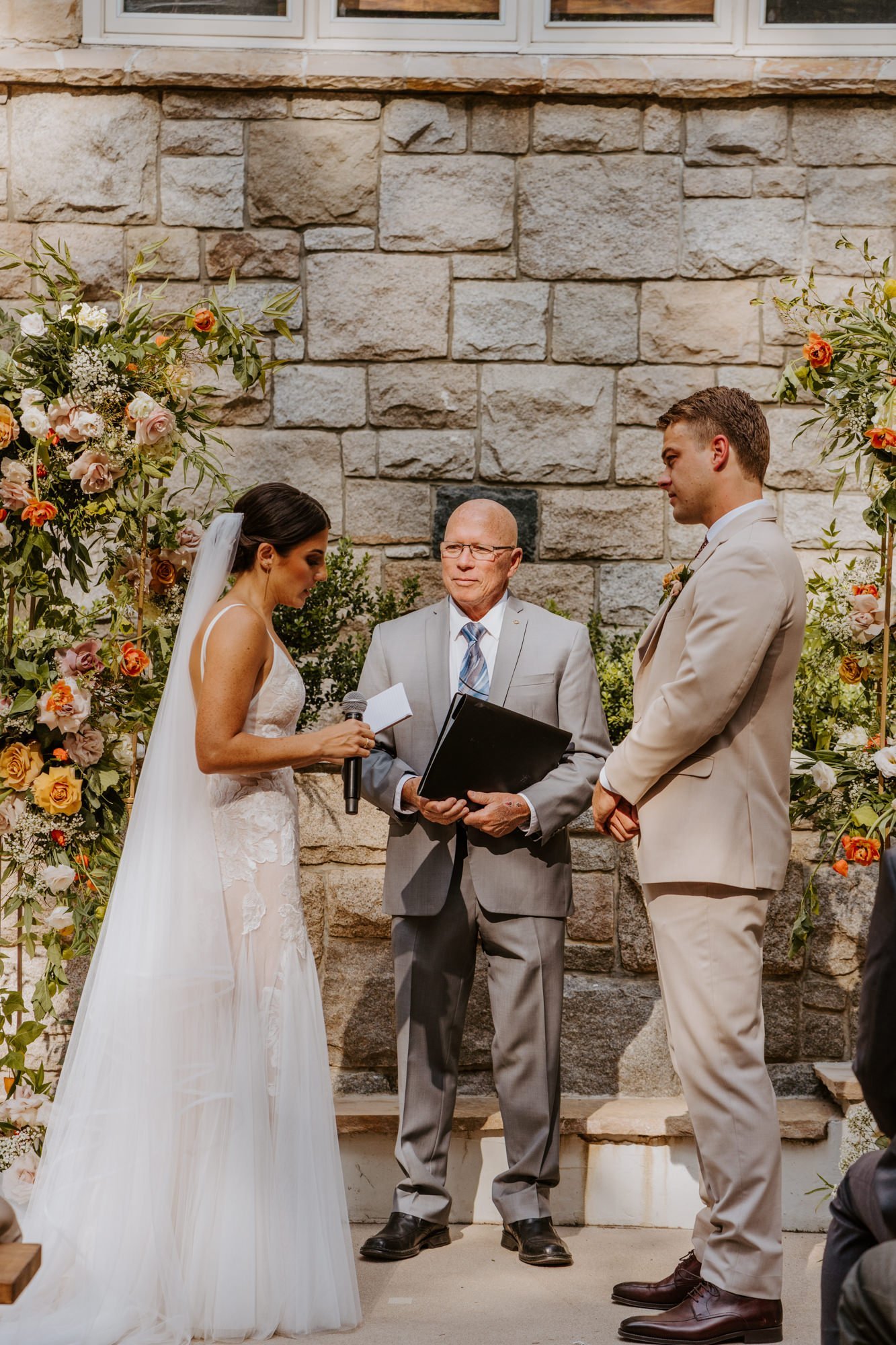 Emotional and candid bride and groom reading vows at wedding ceremony, Castle in the Forest Lake Arrowhead Wedding Ceremony,  Photo by Tida Svy