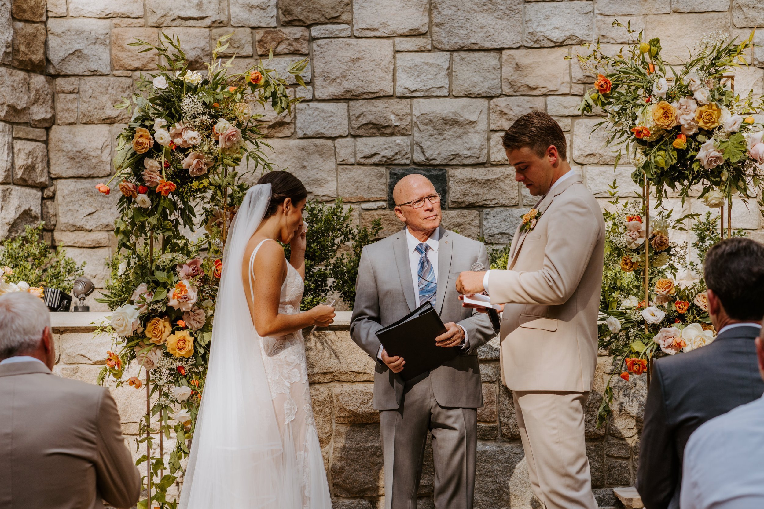 Emotional and candid bride and groom reading vows at wedding ceremony, Castle in the Forest Lake Arrowhead Wedding Ceremony,  Photo by Tida Svy