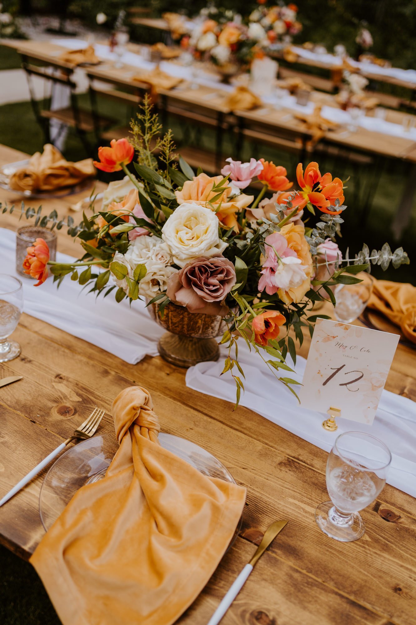 Enchanted forest castle wedding at Castle in the Forest in Lake Arrowhead, magical castle airbnb wedding, whimsical orange pink and beige floral centerpiece, photography by Tida Svy