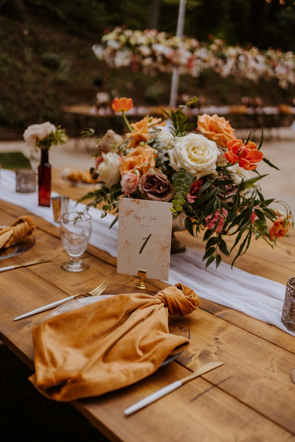 Enchanted forest castle wedding at Castle in the Forest in Lake Arrowhead, magical castle airbnb wedding, whimsical orange pink and beige floral centerpiece, photography by Tida Svy