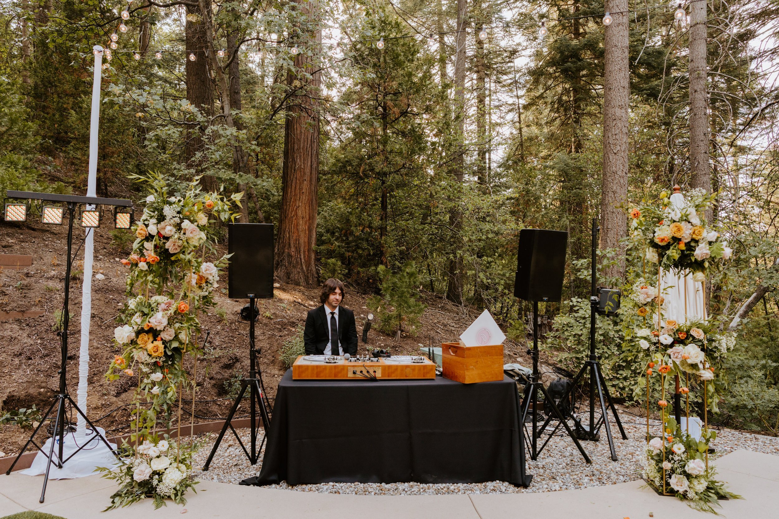 Enchanted forest castle wedding at Castle in the Forest in Lake Arrowhead, magical castle airbnb wedding, long bridal party head table, floating cloud floral centerpiece, photography by Tida Svy