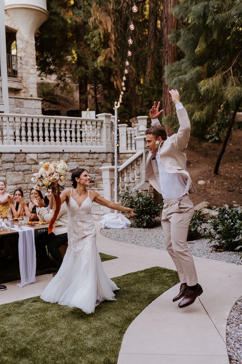 Fun bride and groom reception grand entrance, Castle in the Forest Lake Arrowhead airbnb wedding, Photo by Tida Svy