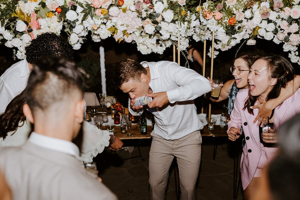 Fun candid dancing wedding reception photography, Castle in the Forest Lake Arrowhead airbnb wedding, Photo by Tida Svy