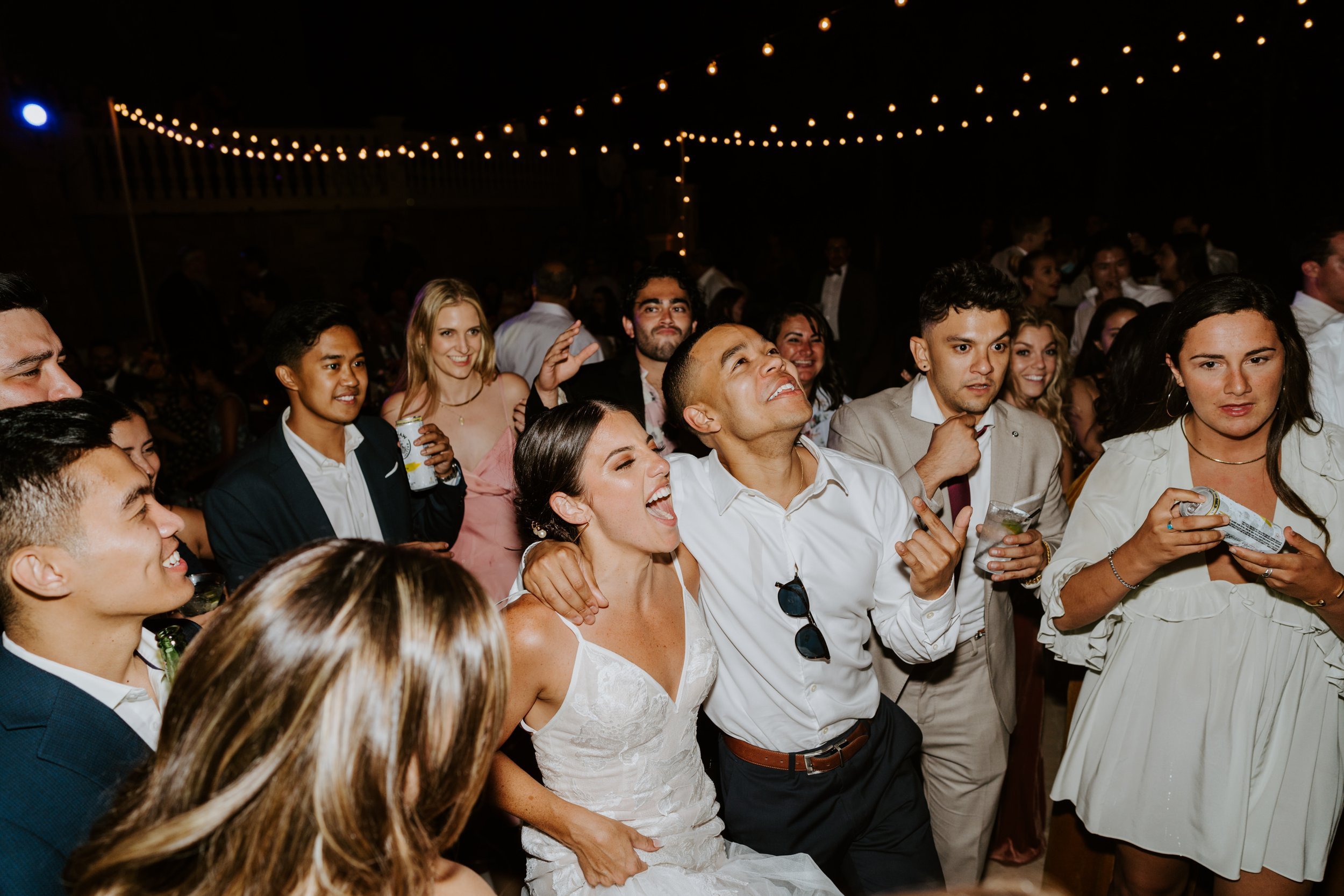 Fun candid dancing wedding reception photography, Castle in the Forest Lake Arrowhead airbnb wedding, Photo by Tida Svy