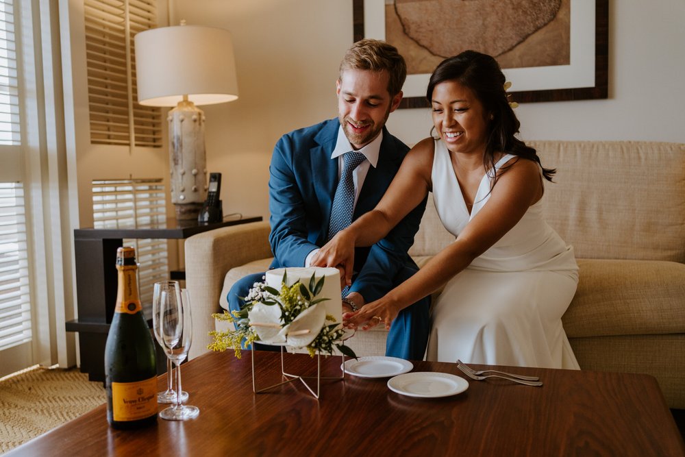 Hawaiian elopement cake cutting | Four Seasons Ko Olina Wedding | Oahu Elopement Photographer | Hawaii Elopement Photographer | Oahu Wedding Photographer