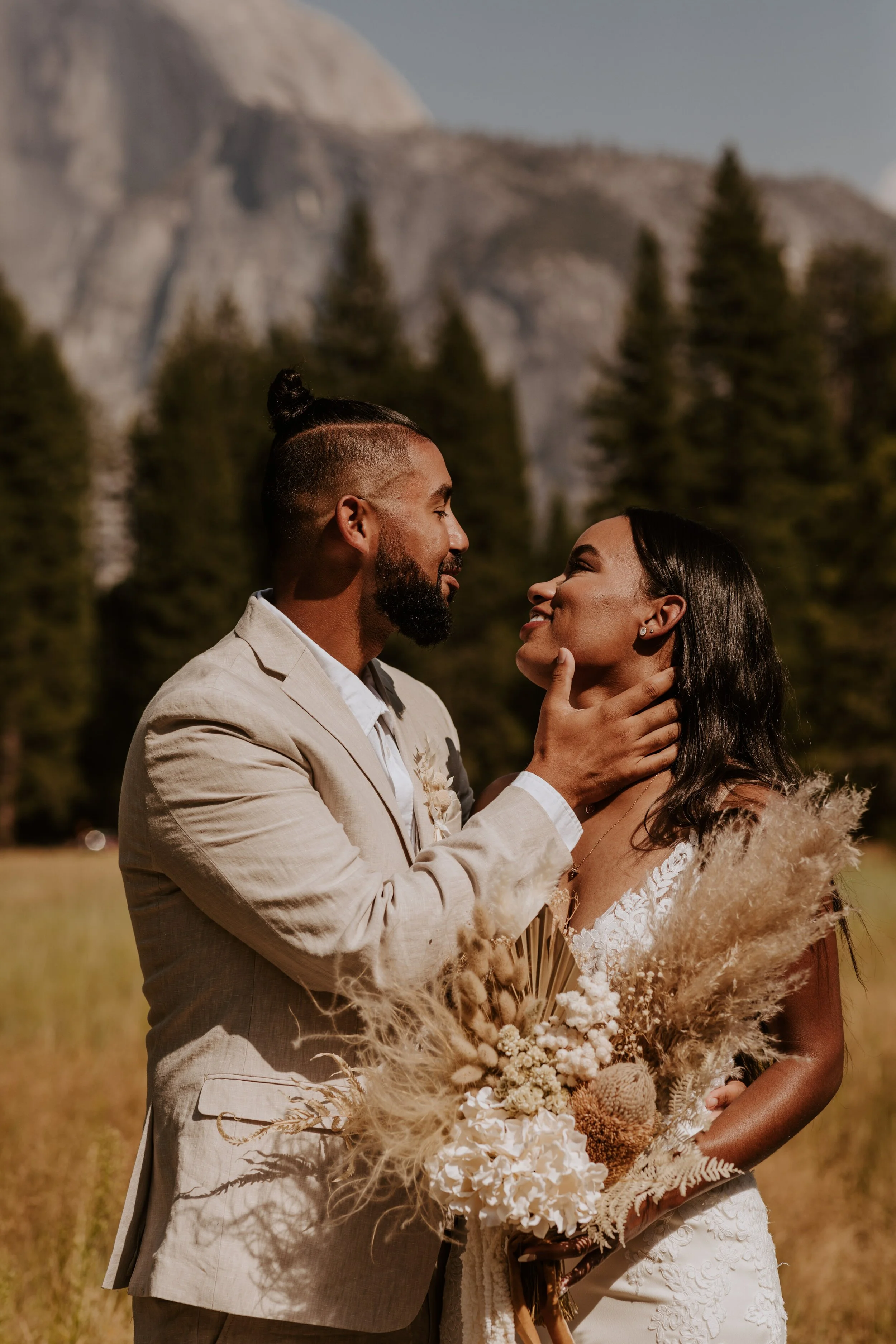 Neutral bride and groom wedding outfit, neutral boho dried floral bouquet by Reed and Rye, Yosemite Valley elopement, Half Dome elopement photography, Tida Svy