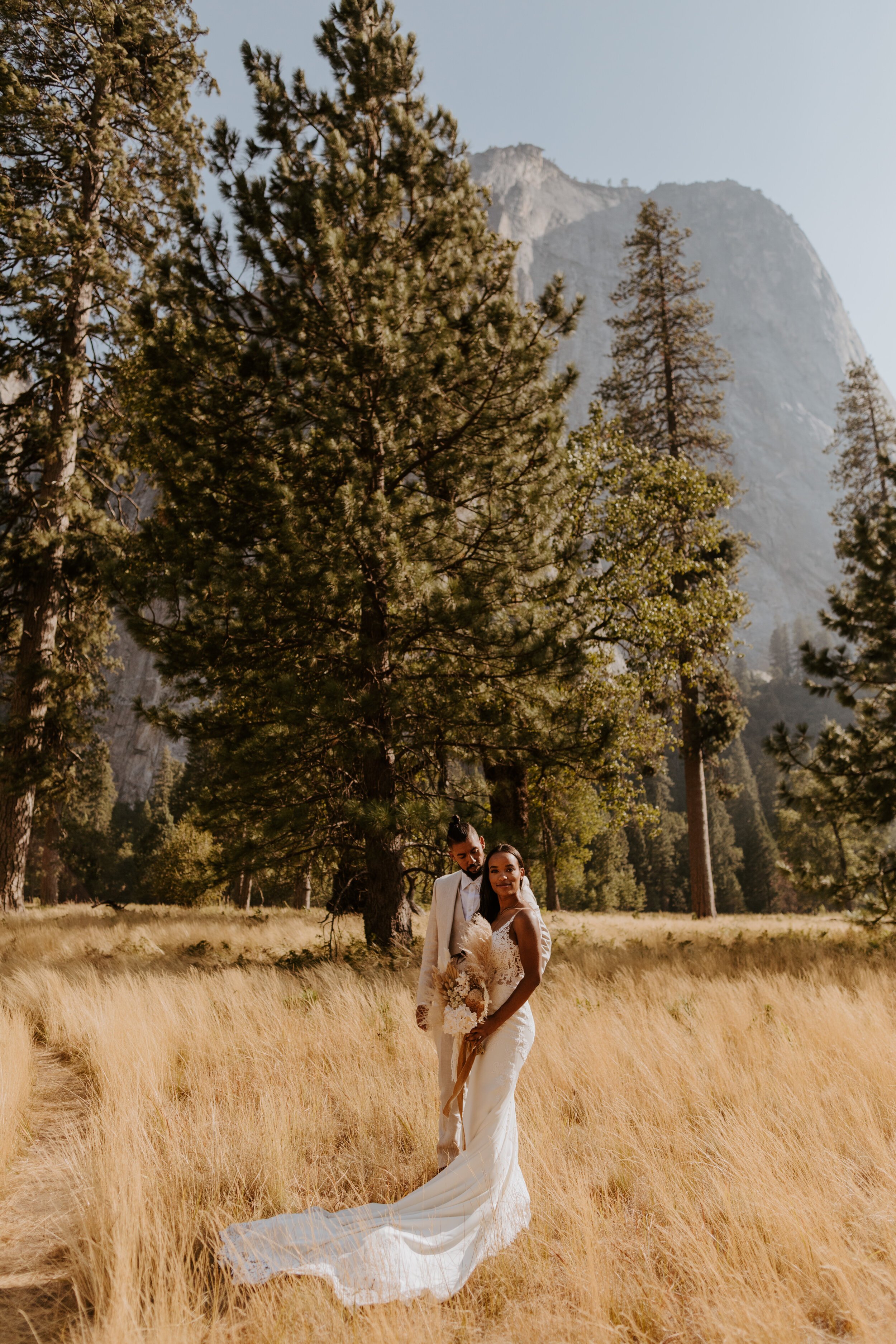 Boho bride with neutral and beige dried floral bouquet by Reed and Rye, Yosemite Elopement, Yosemite Valley, El Capitan Meadow, Tida Svy Photography