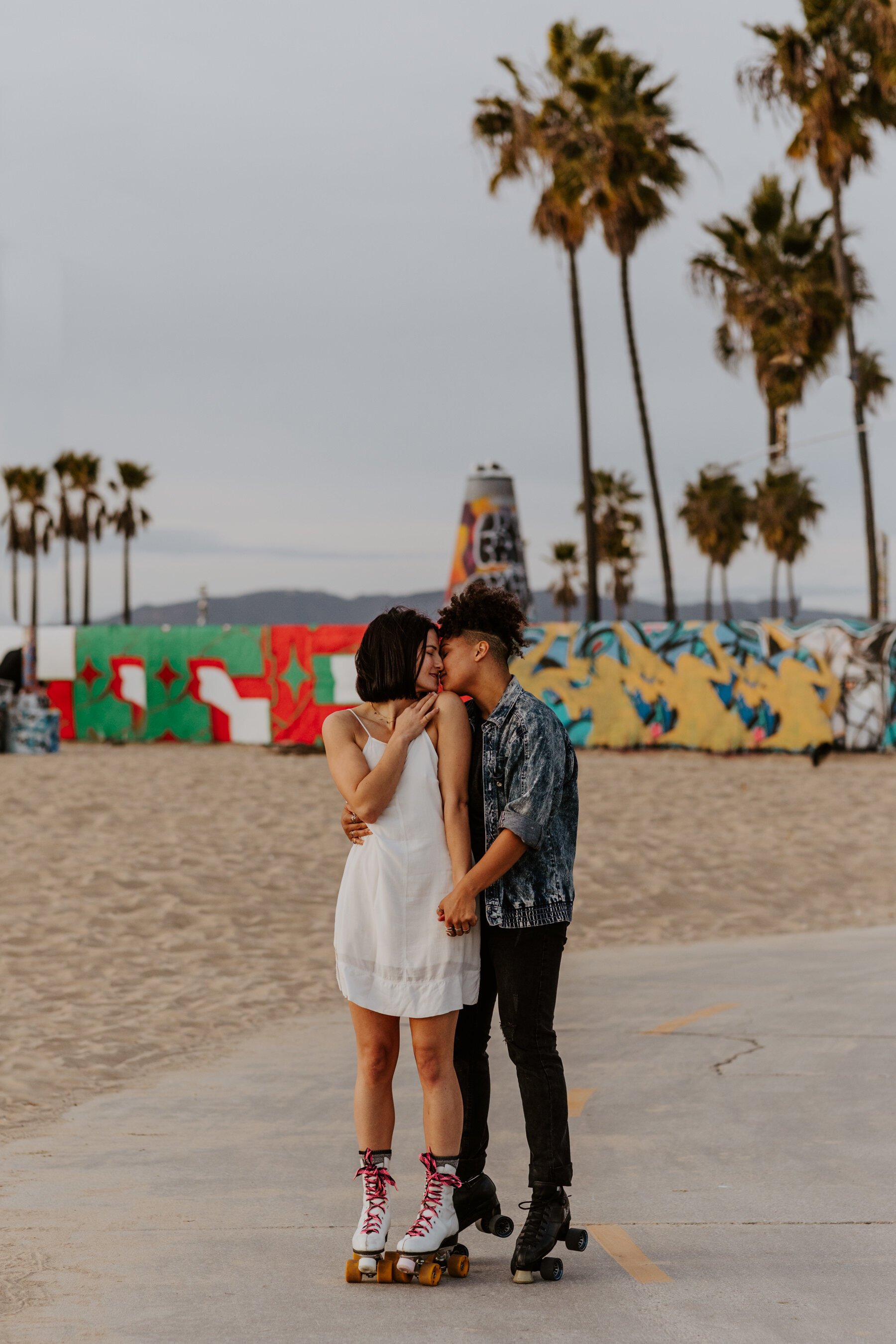 Lesbian engagement session in Venice Beach, CA, roller skating, photography by Tida Svy