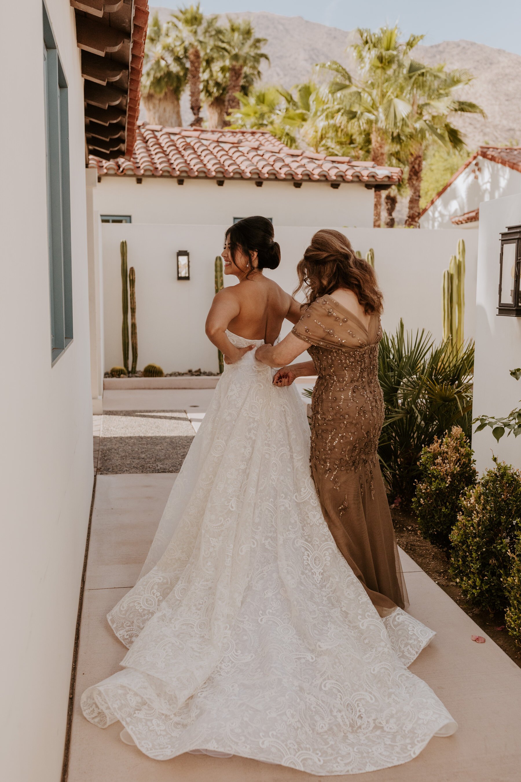 Mom zipping Bride’s Dress, Wedding Getting Ready Photos, La Serena Villas Palm Springs Wedding Photographer, Photo by Tida Svy