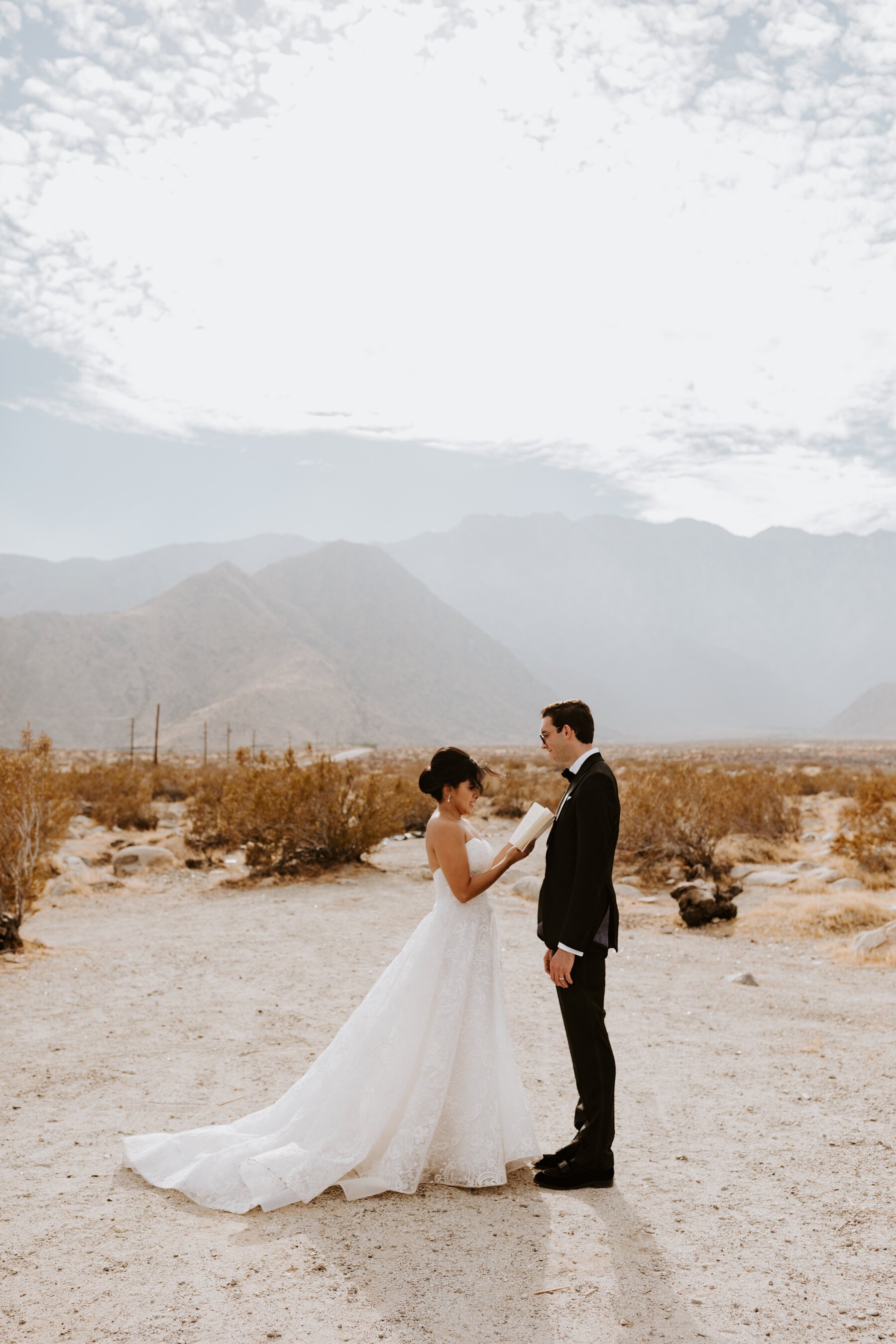 Bride and Groom reading private vows to each other in Palm Springs, Palm Springs Wedding and Elopement Photographer, Photo by Tida Svy
