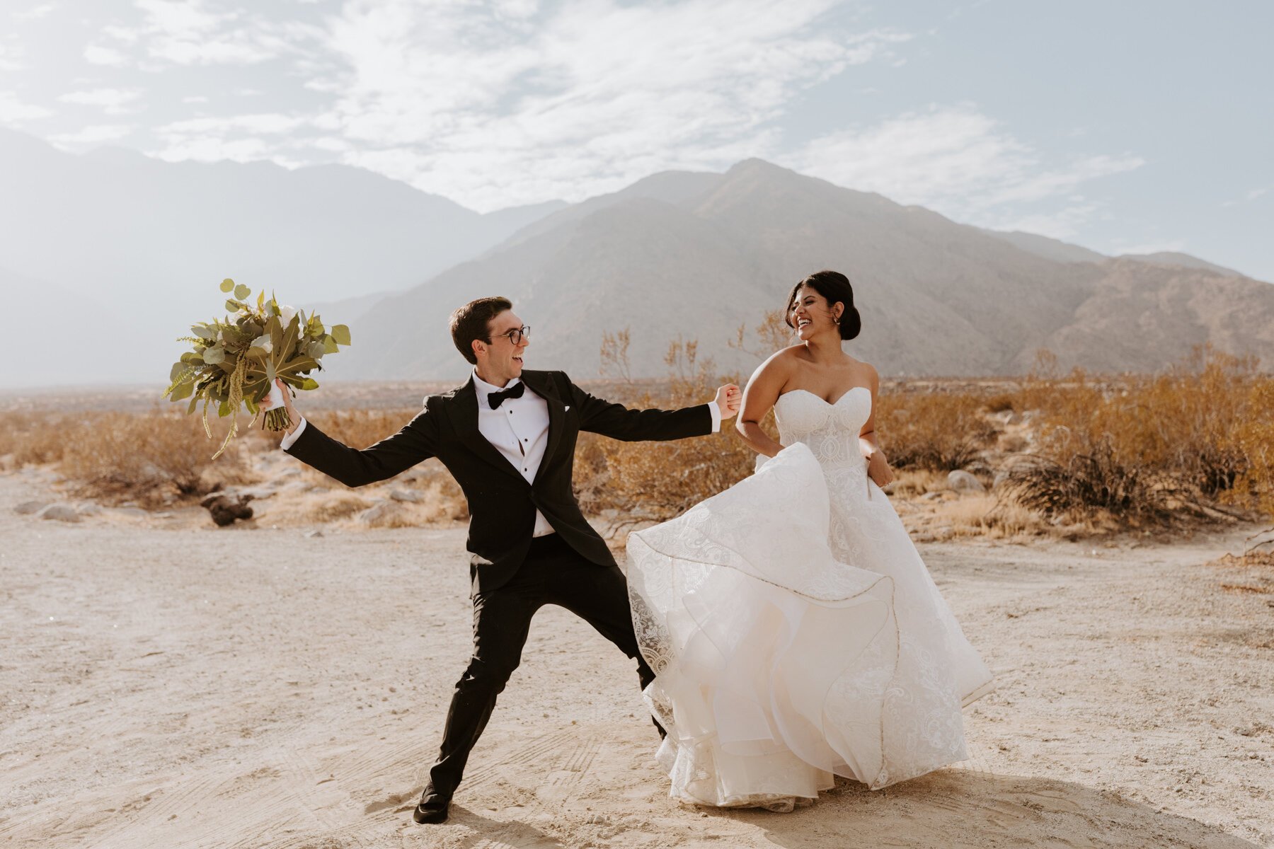 Bride and Groom dancing in the desert, Palm Springs Wedding and Elopement Photographer, Photo by Tida Svy