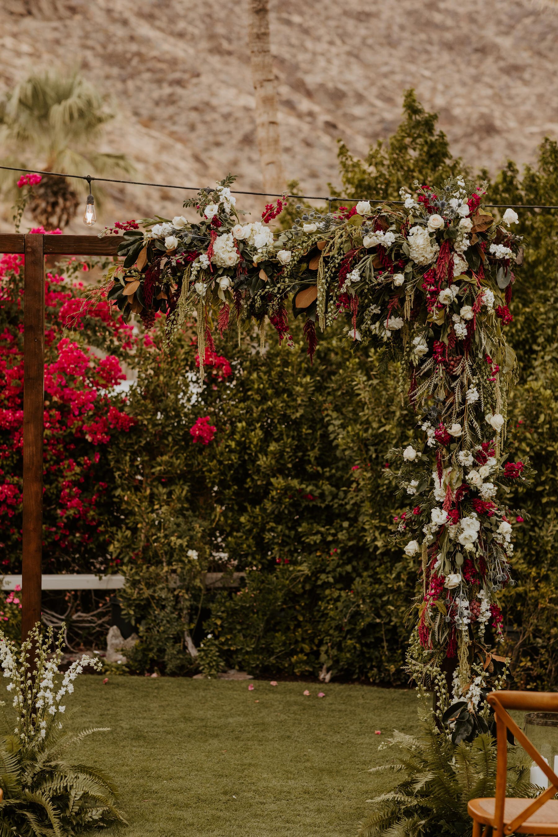 Jewel Toned Burgundy White and Green cascading flowers on rectangle wedding arch, Palm Springs Wedding, Spencer’s Restaurant Palm Springs Wedding, Tida Svy Photo