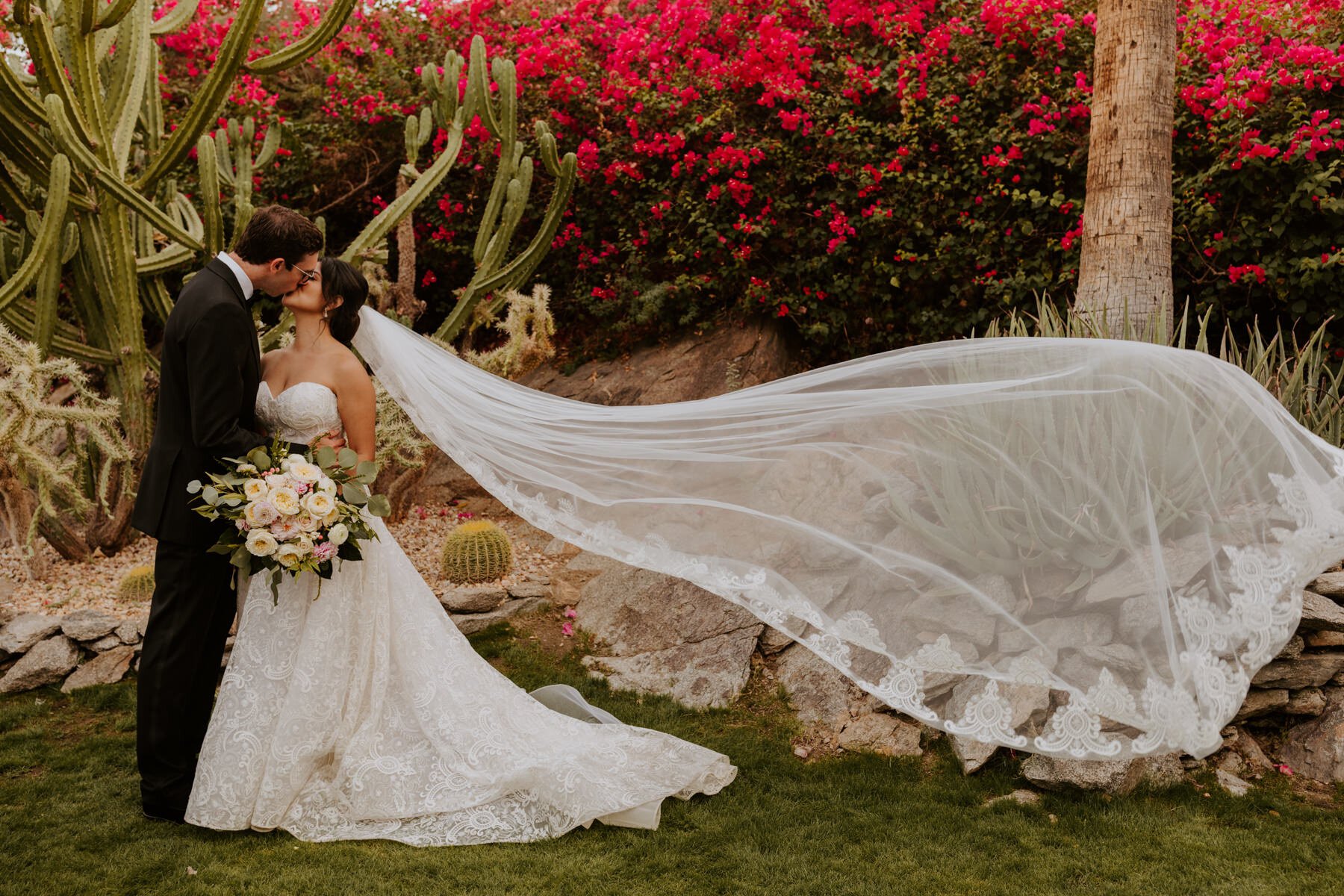 Bride and groom kissing with flowing veil, Spencer’s Restaurant Palm Springs Wedding Ceremony, Palm Springs Wedding Photographer | Tida Svy Photo
